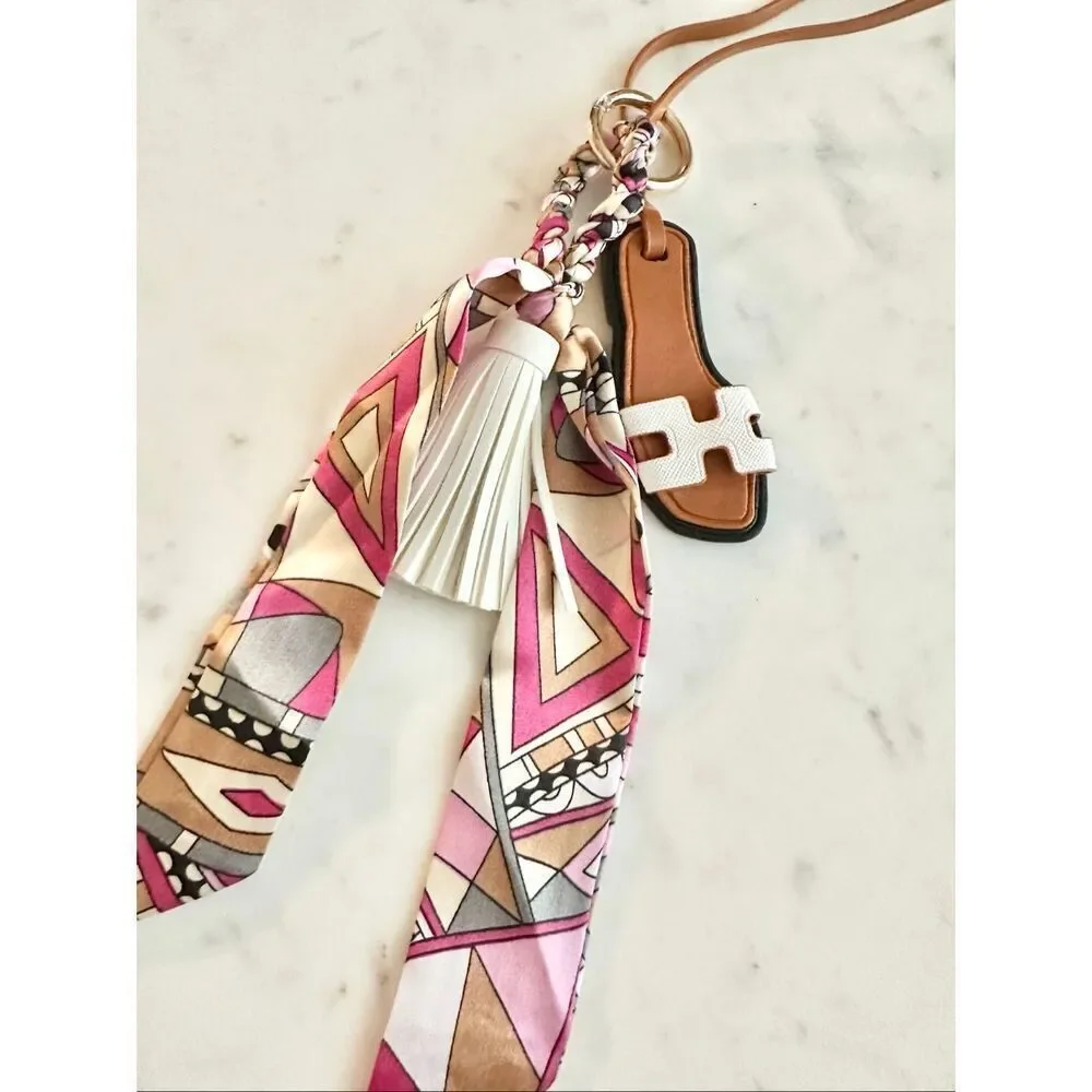 White purse charm flip-flop and pattern scarf